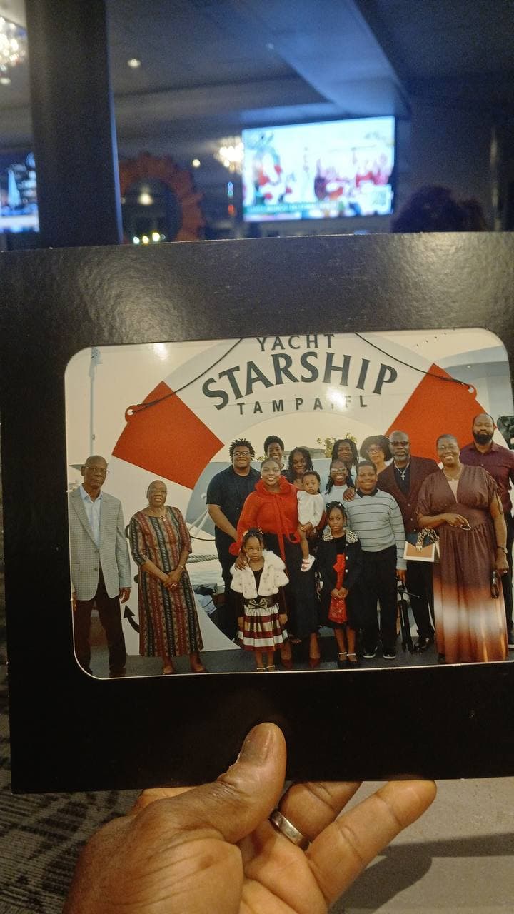 A printed family portrait taken during a Starship Tampa event.