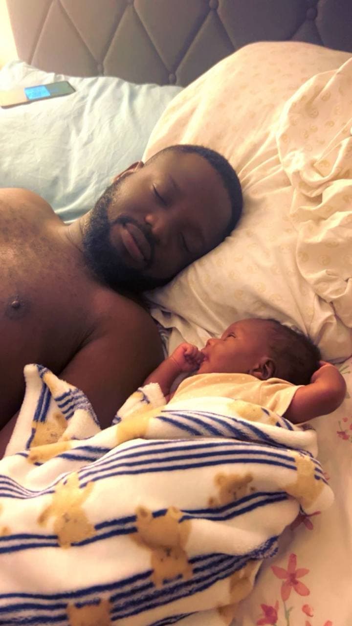 A loved one resting beside a baby.